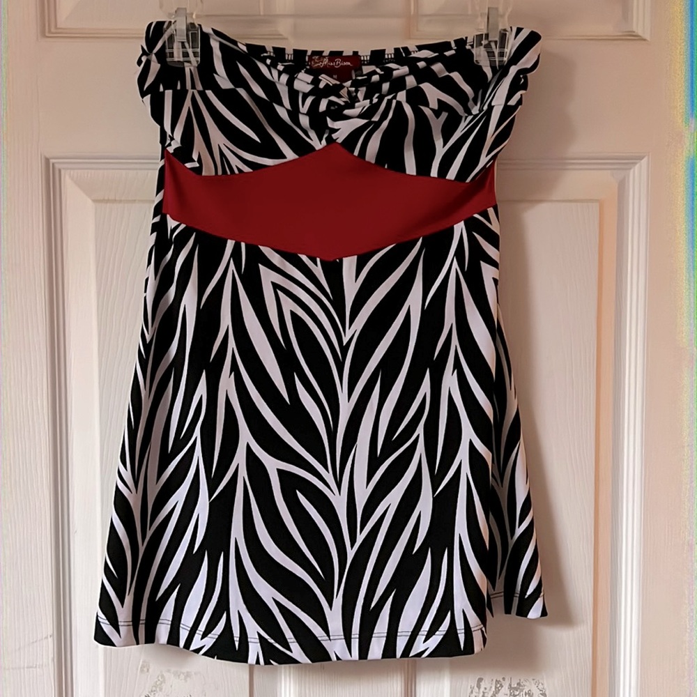 Size medium. Worn once. Strapless zebra print with red accent